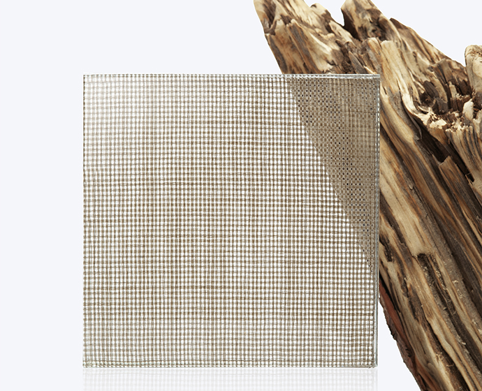 Light transmission through laminated glass fabric panel GLAM Weave Beige demonstrating transparency level